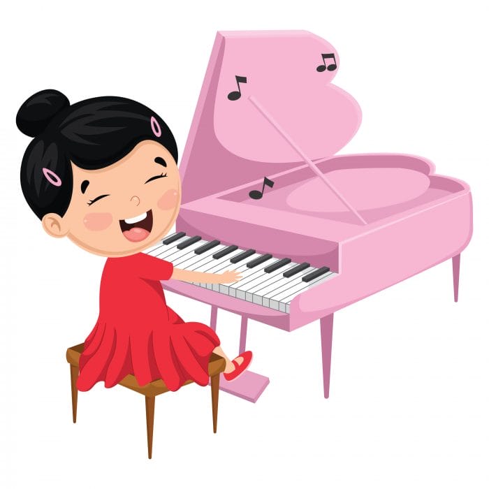Kind spielt an einem rosa Klavier